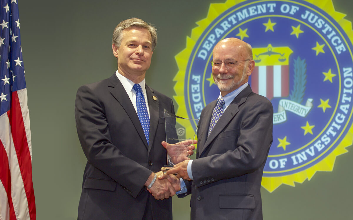FBI Director Christopher Wray and David Dotson, Chief Executive Officer of the Dollywood Foundation